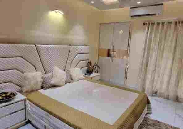 a bed with pillows in a room