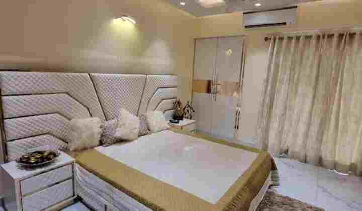 a bed with pillows in a room